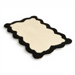 Tapis de bain 100% coton 1200g/m² Nahia écru avec feston noir profond.